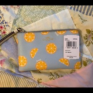 COACH WRISTLET WITH ORANGE PRINT
